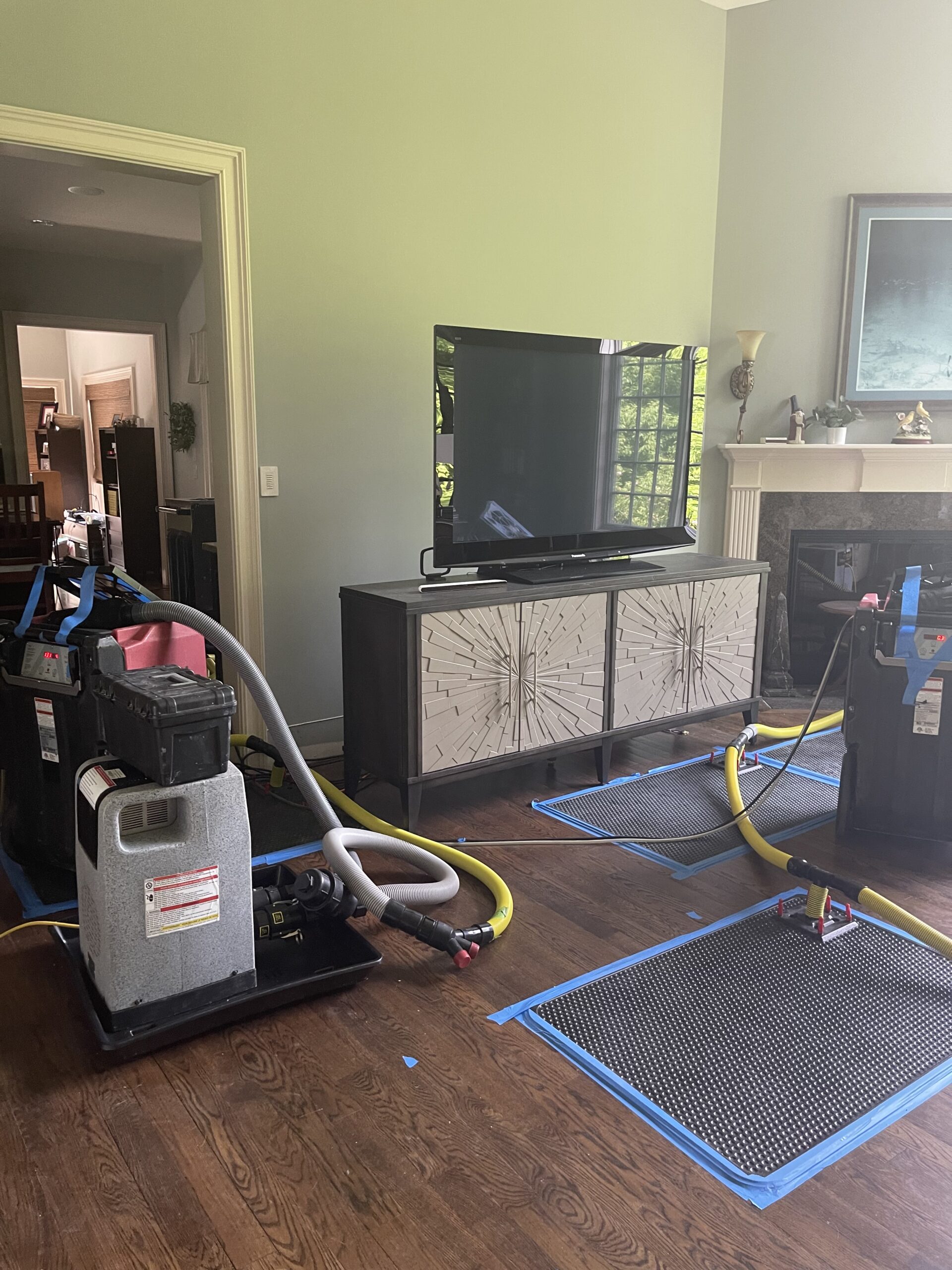 Drying mats and equipment positioned on hardwood flooring