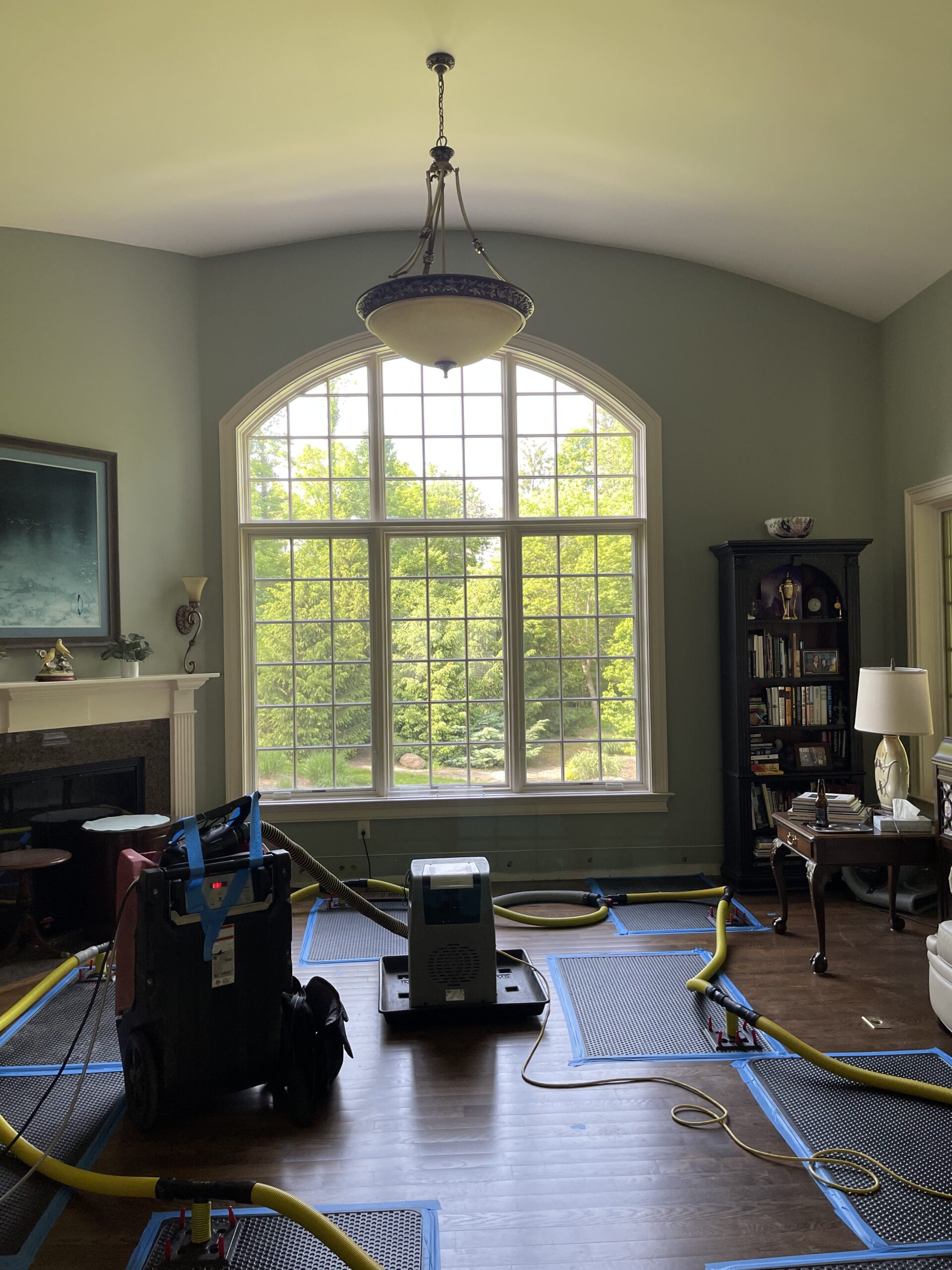 Professional water damage drying equipment on hardwood floors in a Greater Cincinnati home