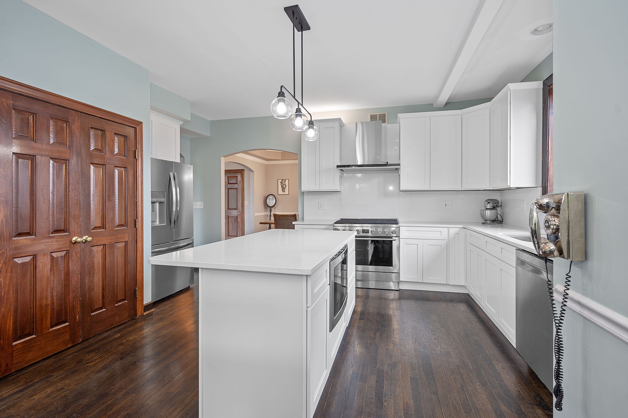 Kitchen and hardwood floors after restoration and remodel