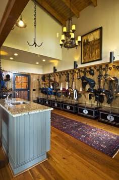 High-end tack room interior with organized saddle and bridle storage